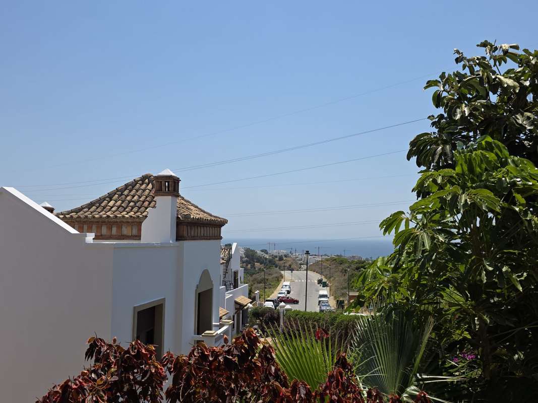 Spacious 3-Bedroom Corner Semi-Detached Townhouse with Private Garage in West Estepona