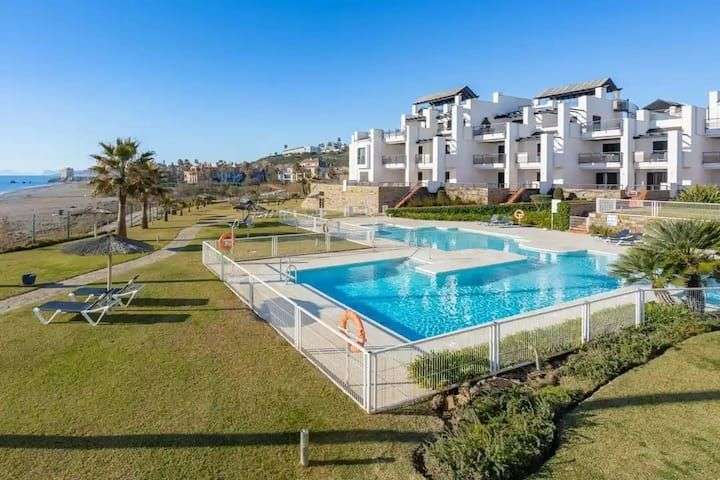 Exclusive beachfront apartment with a large terrace in Casares Costa”